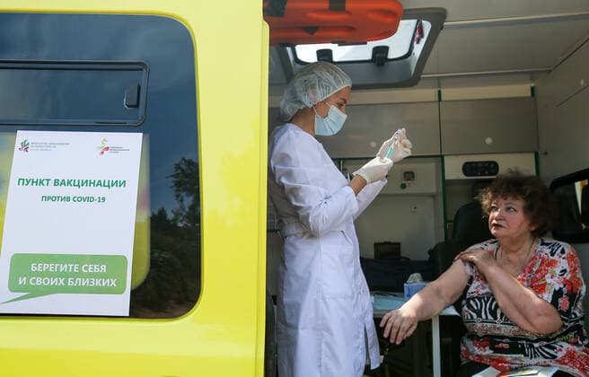 TATARSTAN, RUSSIA - MAY 29, 2021: A woman visits a mobile health unit to receive an injection of the Gam-COVID-Vac (Sputnik V) vaccine against COVID-19 on the premises of the Volga gardening partnership. Yegor Aleyev TASS  TS10204A