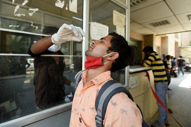 NOIDA, INDIA - MAY 28: A health worker collects a swab sample for Covid-19 test, at a district hospital in Sector 30, on May 28, 2021 in Noida, India. (Photo by Sunil Ghosh Hindustan Times) Medical Team Conducts COVID-19 Coronavirus Test