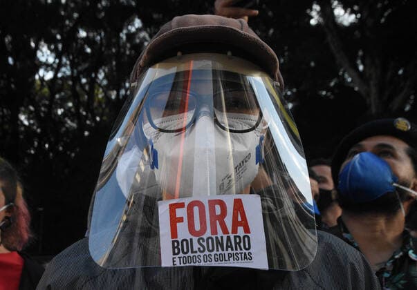 Brazil: Protesters demand vaccination for the entire population Protesters of leftist movements take to the streets with banners, flags and chanting songs and chants of order in protest against President Jair Bolsonaro on Avenida Paulista in São Paulo. Protesters demand vaccination for the entire population, and the fall of the President Bolsonaro. They set fire to a rag doll symbolizing the president. São Paulo SP Brazil Avenida Paulista Copyright: RonaldoxSilva