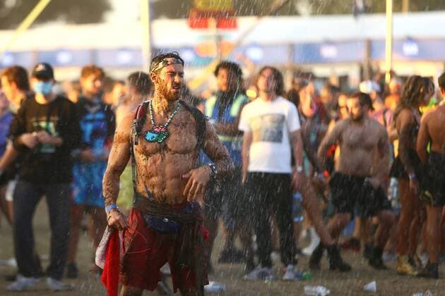 May 30, 2021, Tampa, Florida, USA: An unnamed man dances while a staff member sprays water into the crowd while tens of thousands of electronic music fans gathered during day two of the Sunset Music Festival weekend on Sunday, May 30, 2021 in Tampa. Sunset Music Festival returns to the parking lot of Raymond James Stadium after a one year hiatus during the COVID-19 pandemic shutdowns of 2020. Tampa USA - ZUMAs70_ 20210530_zan_s70_091 Copyright: xLuisxSantanax