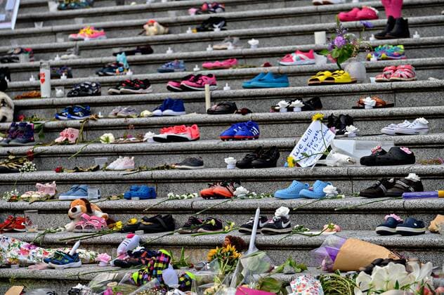(210531) -- VANCOUVER, May 31, 2021 -- Children s shoes and toys are placed on the staircase outside Vancouver Art Gallery during a memorial event for the 215 children whose remains have been found buried at a former Kamloops residential school in Vancouver, British Columbia, Canada, May 30, 2021. (Photo by Xinhua) CANADA-VANCOUVER-KAMLOOPS INDIGENOUS SCHOOL-CHILDREN REMAINS-MEMORIAL AndrewxSoong 