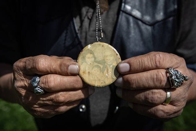 May 31, 2021, Kamloops, BC, Canada: Kamloops Indian Residential School survivor Clayton Peters, 64, who was forced into the school for 10 years, holds a faded photograph of his parents, Nancy and Pete Peters and his older sister Nancy Rose, that he wears around his neck, while visiting the former school in Kamloops, B.C., on Monday, May 31, 2021. Peters parents and his brothers were also forced into the facility. The remains of 215 children have been discovered buried near the former school. Kamloops Canada - ZUMAc35_ 20210531_zaf_c35_069 Copyright: xDarrylxDyckx