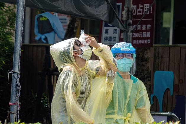 June 1, 2021, Taipei, Taiwan: A woman seen holding a bag of ice against her nose after being tested for Covid-19 at a testing center in New Taipei City..In addition to a broader implementation of Covid-19 testing centers, Taiwan signs a deal for 10 million doses of domestically-made COVID vaccines. Taipei Taiwan - ZUMAs197 20210601_zaa_s197_001 Copyright: xWalidxBerrazegx