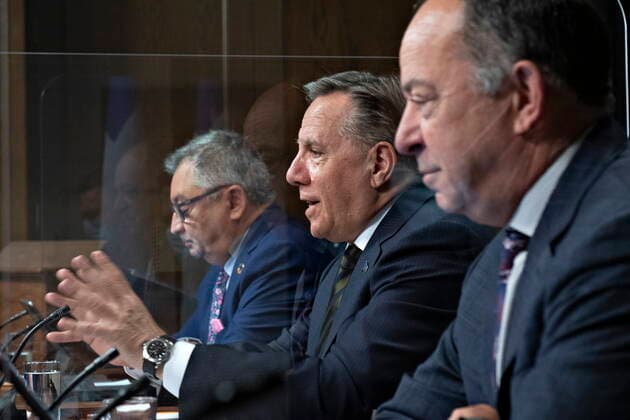 June 1, 2021, QUEBEC, PQ, Canada: Quebec Premier Francois Legault, centre, speaks during a news conference on the COVID-19 pandemic, Tuesday, June 1, 2021 at the legislature in Quebec City. Legault is flanked by Horacio Arruda, Quebec director of National Public Health, left and Quebec Health Minister Christian Dube. QUEBEC Canada - ZUMAc35_ 20210601_zaf_c35_039 Copyright: xJacquesxBoissinotx
