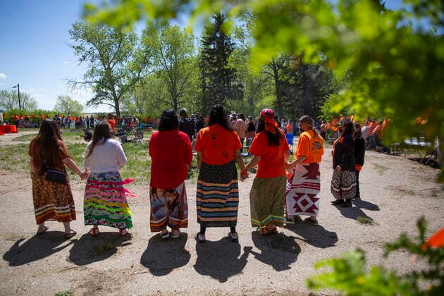 June 1, 2021, Muskowekwan First Nation, SK, Canada: Attendees perform a round dance during a press conference and prayer vigil at the former Muscowequan Indian Residential School, one of the last residential schools to close its doors in Canada in 1997 and the last fully intact residential school still standing in Saskatchewan at Muskowekwan First Nation, Sask., on Tuesday, June 1, 2021. The vigil was in response to the remains of 215 children recently found at the Kamloops Indian Residential School. Muskowekwan First Nation Canada  - ZUMAc35_ 20210601_zaf_c35_076 Copyright: xKaylexNeisx