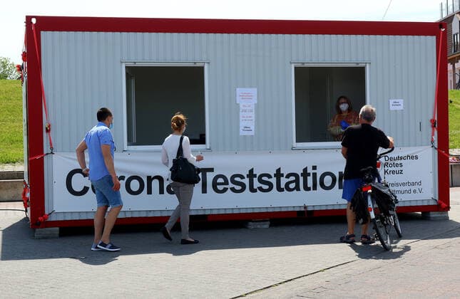 German Red Cross Corona test station in the harbour of Neuharlingersiel,state-approved North Sea health resort at the North Sea,municipality in Niederschsen in the federal state Lower Saxony From the ferry pier in the harbou