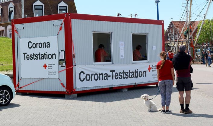 German Red Cross Corona test station in the harbour of Neuharlingersiel,state-approved North Sea health resort at the North Sea,municipality in Niederschsen in the federal state Lower Saxony From the ferry pier in the harbou