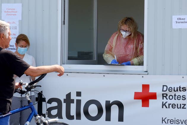 German Red Cross Corona test station in the harbour of Neuharlingersiel,state-approved North Sea health resort at the North Sea,municipality in Niederschsen in the federal state Lower Saxony From the ferry pier in the harbou