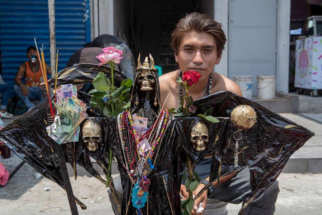 June 1, 2021, Mexico City, Mexico City, Mexico: A faithful holds a statue of Santa Muerte, while arriving at the Altar of Santa Muerte in the town of Tepito, as part of the celebrations that held on the first day of each month, hundreds of devotees attend to venerate it, give thanks for the favors and the fulfilled promises that this deity has granted them. La Santa Muerte or Santisima Muerte is a popular Mexican figure who personifies death and is an object of worship, the devotees of her are usually perceived as people associated with crime, gang activity, prostitution, drug trafficking. On June 1, 2021 in Mexico City, Mexico. Mexico City Mexico - ZUMAe321 20210601_zia_e321_009 Copyright: xRicardoxFloresx