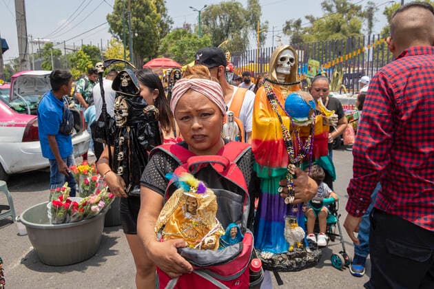 June 1, 2021, Mexico City, Mexico City, Mexico: A faithful holds a statue of Santa Muerte, while arriving at the Altar of Santa Muerte in the town of Tepito, as part of the celebrations that held on the first day of each month, hundreds of devotees attend to venerate it, give thanks for the favors and the fulfilled promises that this deity has granted them. La Santa Muerte or Santisima Muerte is a popular Mexican figure who personifies death and is an object of worship, the devotees of her are usually perceived as people associated with crime, gang activity, prostitution, drug trafficking. On June 1, 2021 in Mexico City, Mexico. Mexico City Mexico - ZUMAe321 20210601_zia_e321_010 Copyright: xRicardoxFloresx