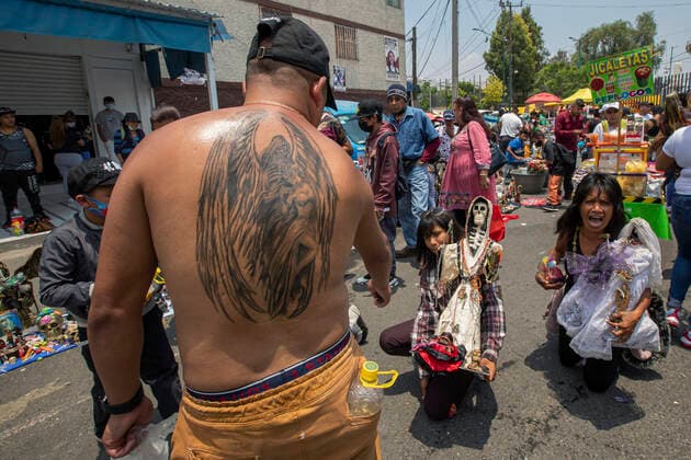June 1, 2021, Mexico City, Mexico City, Mexico: A faithful holds a statue of Santa Muerte, while arriving at the Altar of Santa Muerte in the town of Tepito, as part of the celebrations that held on the first day of each month, hundreds of devotees attend to venerate it, give thanks for the favors and the fulfilled promises that this deity has granted them. La Santa Muerte or Santisima Muerte is a popular Mexican figure who personifies death and is an object of worship, the devotees of her are usually perceived as people associated with crime, gang activity, prostitution, drug trafficking. On June 1, 2021 in Mexico City, Mexico. Mexico City Mexico - ZUMAe321 20210601_zia_e321_011 Copyright: xRicardoxFloresx