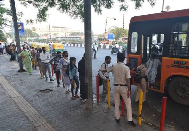 NEW DELHI, INDIA - JUNE 1: People boarding a bus at a bus stand at ISBT on June 1, 2021 in New Delhi, India. As due to Covid relaxations Metro services are yet not opened and DTC buses operating at 50% occupancy, daily commuters are facing problem. (Photo by Sonu Mehta Hindustan Times) Bus Passengers Face Difficulty In Delhi Due To Covid Restrictions