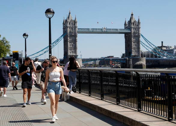 (210602) -- LONDON, June 2, 2021 -- People walk along the River Thames, backdropped by the Tower Bridge, in London, Britain, June 1, 2021. Britain remains in a vulnerable position in fighting coronavirus despite the progress of the country s vaccination program, a scientist advising the British government said Tuesday. Professor Adam Finn from the Joint Committee on Vaccination and Immunisation, which advises the government on vaccine priority, said the job to contain the pandemic is not done as large numbers of people are still unvaccinated. ) BRITAIN-LONDON-COVID-19 HanxYan