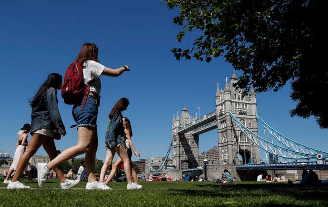 (210602) -- LONDON, June 2, 2021 -- People walk at Potters Fields Park in front of the Tower Bridge in London, Britain, June 1, 2021. Britain remains in a vulnerable position in fighting coronavirus despite the progress of the country s vaccination program, a scientist advising the British government said Tuesday. Professor Adam Finn from the Joint Committee on Vaccination and Immunisation, which advises the government on vaccine priority, said the job to contain the pandemic is not done as large numbers of people are still unvaccinated. ) BRITAIN-LONDON-COVID-19 HanxYan 