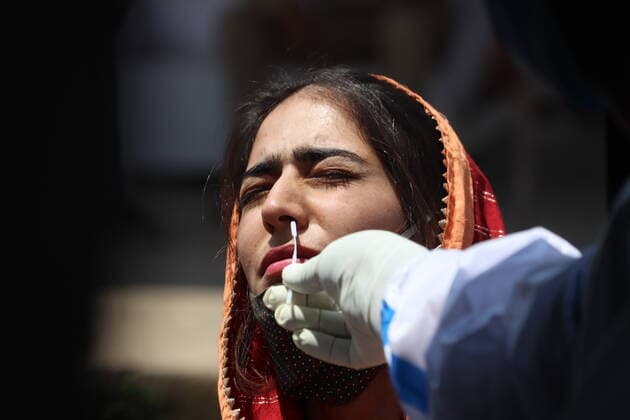 June 2, 2021, Poonch, Jammu and Kashmir, India: A health worker collects a nasal sample for Covid-19 testing of a woman, in Poonch Poonch India - ZUMAk155 20210602_zip_k155_010 Copyright: xNazimxAlixKhanx