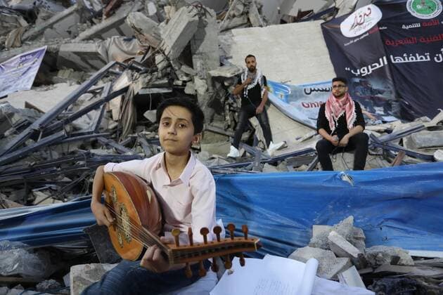 June 2, 2021, Gaza city, Gaza Strip, Palestinian Territory: Palestinian artists perform during an event on the rubble of Hanadi tower which was destroyed after Israeli airstrikes last month in Gaza city on June 2, 2021 Gaza city Palestinian Territory - ZUMAap3_ 20210602_zaf_ap3_173 Copyright: xAshrafxAmrax