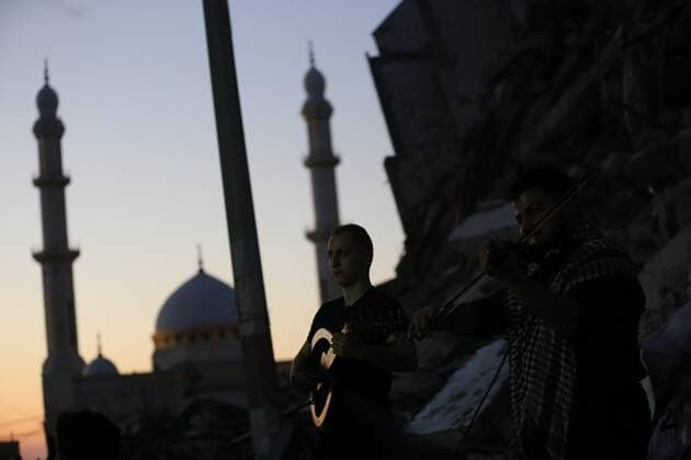 June 2, 2021, Gaza city, Gaza Strip, Palestinian Territory: Palestinian artists perform during an event on the rubble of Hanadi tower which was destroyed after Israeli airstrikes last month in Gaza city on June 2, 2021 Gaza city Palestinian Territory - ZUMAap3_ 20210602_zaf_ap3_183 Copyright: xAshrafxAmrax