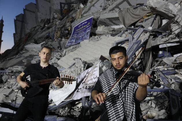 June 2, 2021, Gaza city, Gaza Strip, Palestinian Territory: Palestinian artists perform during an event on the rubble of Hanadi tower which was destroyed after Israeli airstrikes last month in Gaza city on June 2, 2021 Gaza city Palestinian Territory - ZUMAap3_ 20210602_zaf_ap3_210 Copyright: xAshrafxAmrax