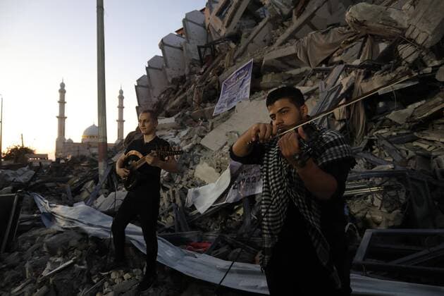 June 2, 2021, Gaza city, Gaza Strip, Palestinian Territory: Palestinian artists perform during an event on the rubble of Hanadi tower which was destroyed after Israeli airstrikes last month in Gaza city on June 2, 2021 Gaza city Palestinian Territory - ZUMAap3_ 20210602_zaf_ap3_215 Copyright: xAshrafxAmrax