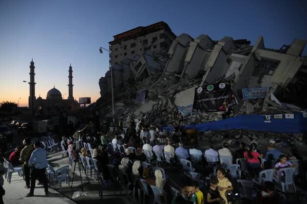 June 2, 2021, Gaza city, Gaza Strip, Palestinian Territory: Palestinian artists perform during an event on the rubble of Hanadi tower which was destroyed after Israeli airstrikes last month in Gaza city on June 2, 2021 Gaza city Palestinian Territory - ZUMAap3_ 20210602_zaf_ap3_216 Copyright: xAshrafxAmrax