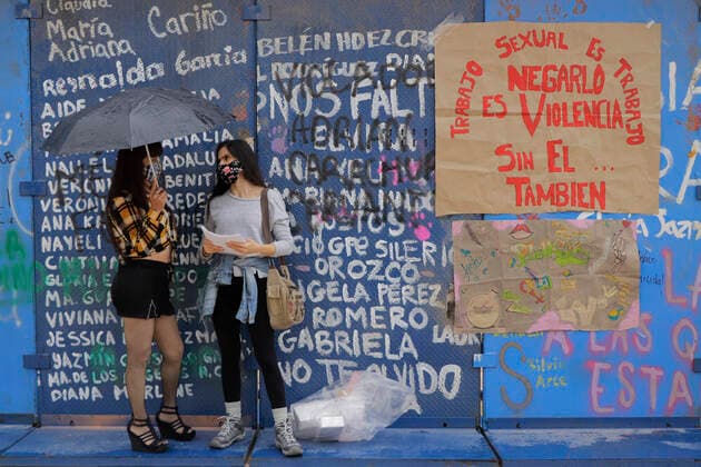 International Day Of Sex Workers In Mexico Two sex workers take shelter from the rain in front of a metal fence under the Monument to the Revolution in Mexico City during the International Day of Sex Workers, during the COVID-19 health emergency and yellow epidemiological traffic light in the capital. Mexico City Mexico vieyra-notitle210602_npWuy  Copyright: xGerardoxVieyrax