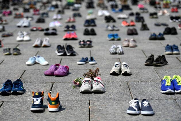 June 4, 2021, Ottawa, on, Canada: Dried flowers rest inside a pair of child s running shoes at a memorial for the 215 children whose remains were found at the grounds of the former Kamloops Indian Residential School at TkÃ¢â‚¬â ¢emlups te Secwo pemc First Nation in Kamloops, B.C., on Parliament Hill in Ottawa on Friday, June 4, 2021. Ottawa Canada  - ZUMAc35_ 20210604_zaf_c35_039 Copyright: xJustinxTangx