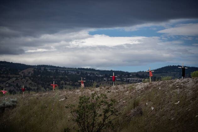 June 4, 2021, Kamloops, BC, Canada: Children s dresses are hung on a crosses near the former Kamloops Indian Residential School, to honour the 215 children whose remains have been discovered buried near the facility, in Kamloops, B.C., on Friday, June 4, 2021. Kamloops Canada - ZUMAc35_ 20210604_zaf_c35_090 Copyright: xDarrylxDyckx