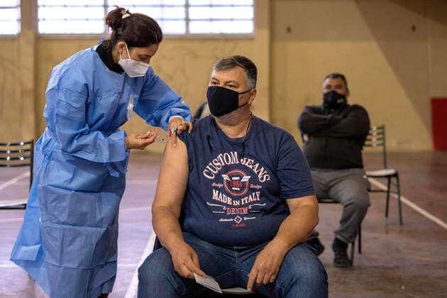 June 5, 2021, Firmat, Santa Fe, Argentina: A man gets a shot of Sputnik v vaccine Inside a makeshift vaccination center at a basketball court..Argentina carries on with an ambitious immunization programme, and as local production of Sputnik V vaccine starts, the country is also receiving a steady flow of vaccines. Firmat Argentina - ZUMAs197 20210605_zaa_s197_130 Copyright: xPatricioxMurphyx