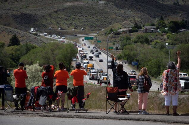 June 5, 2021, Kamloops, BC, Canada: People watch and wave as a convoy of truckers and other vehicles travel on Hwy 5 in support of the Tk emlups te Secwepemc people after the remains of 215 children were discovered buried near the former Kamloops Indian Residential School, in Kamloops, B.C., on Saturday, June 5, 2021. Kamloops Canada  - ZUMAc35_ 20210605_zaf_c35_035 Copyright: xDarrylxDyckx