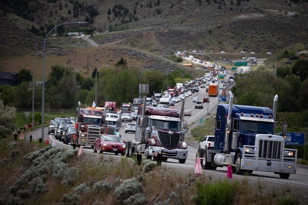 June 5, 2021, Kamloops, BC, Canada: Dresses are seen on crosses as a convoy of truckers and other vehicles travel on Hwy 5 in support of the Tk emlups te Secwepemc people after the remains of 215 children were discovered buried near the former Kamloops Indian Residential School, in Kamloops, B.C., on Saturday, June 5, 2021. Kamloops Canada  - ZUMAc35_ 20210605_zaf_c35_039 Copyright: xDarrylxDyckx