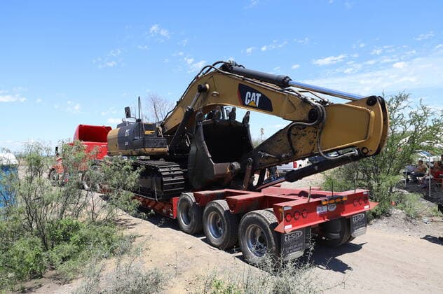 (210606) -- COAHUILA, June 6, 2021 -- A cargo vehicle carries an excavator at the site of the collapse of a mine in Rancherias of Muzquiz municipality, in Coahuila state, Mexico, on June 5, 2021. At least one person died after a mine flooded and then collapsed in the Mexican municipality of Muzquiz in the northern state of Coahuila, Mexico s National Civil Protection Coordination said on Saturday. The agency said on Twitter that six workers were still trapped in the mine. ) MEXICO-COAHUILA-MINE-COLLAPSE AlejandroxRodriguez 