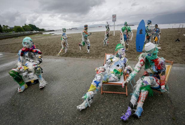 (210606) -- VANCOUVER, June 6, 2021 -- Figures made with plastics removed from shorelines are displayed at Kitsilano Beach in Vancouver, British Columbia, Canada, on June 6, 2021. Created by multidisciplinary artist Caitlin Doherty and made with plastics removed from Canadian shorelines, a set of figures named plastic beachgoers embody people s collective contribution to plastic pollution, bring the topic of shoreline pollution to the forefront. (Photo by Xinhua) CANADA-VANCOUVER-INSTALLATIONS-PLASTIC BEACHGOERS LiangxSen 