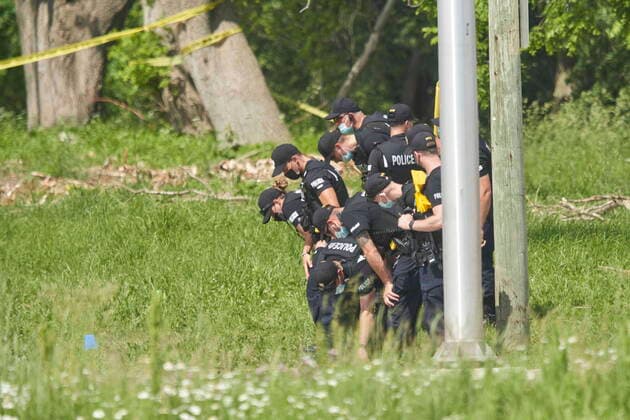 June 7, 2021, London, Ontario, Canada: A line of police officers look for evidence at the scene of a car crash in London, Ontario on Monday, June 7, 2021. Police in London, Ont., say four people have died after several pedestrians were struck by a car Sunday night. London Canada  - ZUMAc35_ 20210607_zaf_c35_021 Copyright: xGeoffxRobinsx