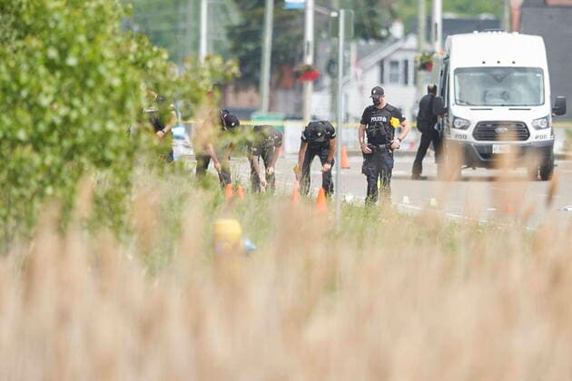 June 7, 2021, London, Ontario, Canada: A line of police officers look for evidence at the scene of a car crash in London, Ontario on Monday, June 7, 2021. Police in London, Ont., say four people have died after several pedestrians were struck by a car Sunday night. London Canada  - ZUMAc35_ 20210607_zaf_c35_022 Copyright: xGeoffxRobinsx