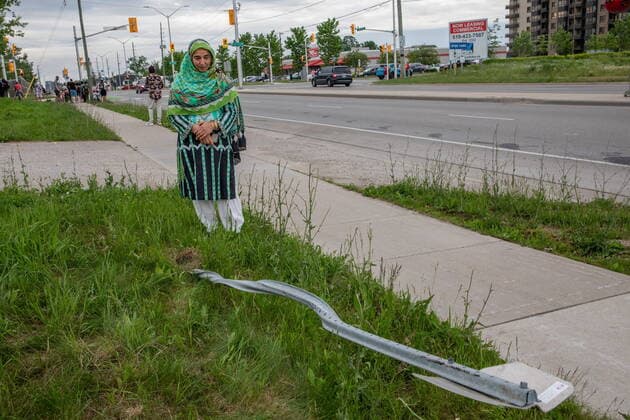 June 7, 2021, London, on, Canada: Torpenky Khan looks at a street sign that was destryoed at the location where a family of five was hit by a driver, in London, Ont., Monday, June 7, 2021. Four of the members of the family died and one is in critical condition. A 20 year old male has been charged with four counts of first degree murder and count of attempted murder in connection with the crime. London Canada  - ZUMAc35_ 20210607_zaf_c35_080 Copyright: xBrettxGundlockx