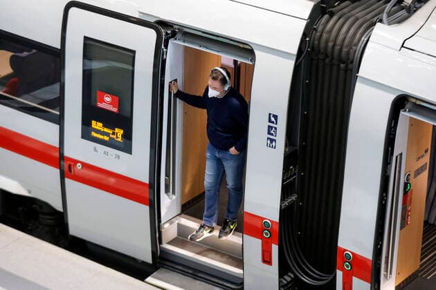 Deutsche Bahn Berlin, 08 06 2021 A passenger wearing an FFP2 mask stands in the entrance of an ICE train at Berlin station Berlin Berlin Germany
