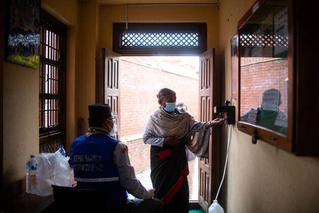 Nepal Continue COVID-19 Vaccination Drive A Nepalese woman sanitizes her hands as she arrives to receive a dose of the Vero cell COVID-19 vaccine in Bhaktapur, Nepal on Tuesday, June 8, 2021. After receiving 1 million doses of the COVID-19 vaccine from china, the Nepal government has continued vaccination for the 60-64 age groups. Kathmandu Nepal shrestha-notitle210608_npIND  Copyright: xRojanxShresthax