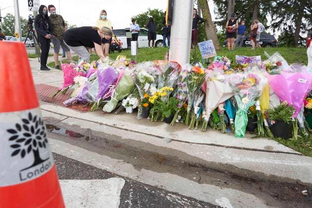 June 8, 2021, London, Ontario, Canada: Mourners place flowers at the scene of a hate-motivated vehicle attack in London, Ont. on Tuesday, June 8, 2021, which left four members of a family dead and their nine-year-old son in hospital. London Canada  - ZUMAc35_ 20210608_zaf_c35_063 Copyright: xGeoffxRobinsx
