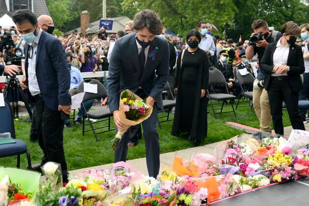 June 8, 2021, London, on, Canada: Prime Minister Justin Trudeau places flowers at a vigil for the victims of the deadly vehicle attack on five members of the Canadian Muslim community in London, Ont., on Tuesday, June 8, 2021. Four of the members of the family died and one is in critical condition. Police have charged a London man with four counts of murder and one count of attempted murder. London Canada  - ZUMAc35_ 20210608_zaf_c35_147 Copyright: xNathanxDenettex