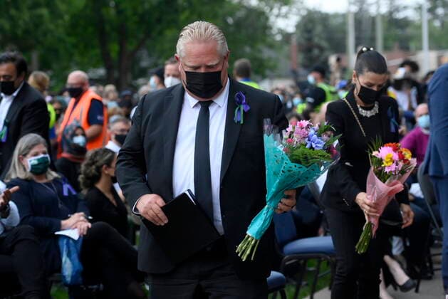 June 8, 2021, London, on, Canada: Ontario Premier Doug Ford walks to place flowers at a vigil for the victims of the deadly vehicle attack on five members of the Canadian Muslim community in London, Ont., on Tuesday, June 8, 2021. Four of the members of the family died and one is in critical condition. Police have charged a London man with four counts of murder and one count of attempted murder. London Canada  - ZUMAc35_ 20210608_zaf_c35_150 Copyright: xNathanxDenettex