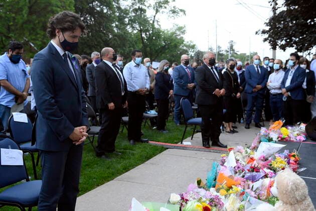 June 8, 2021, London, on, Canada: Prime Minister Justin Trudeau, left, and Ontario Premier Doug Ford, fourth from right, look on during moment of silence at a vigil for the victims of the deadly vehicle attack on five members of the Canadian Muslim community in London, Ont., on Tuesday, June 8, 2021. Four of the members of the family died and one is in critical condition. Police have charged a London man with four counts of murder and one count of attempted murder. London Canada - ZUMAc35_ 20210608_zaf_c35_154 Copyright: xNathanxDenettex