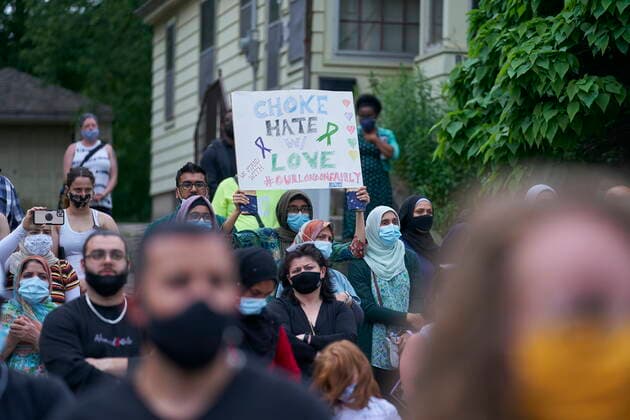 June 8, 2021, London, on, Canada: A woman holds a sign during a vigil at the London Muslim Mosque in London, Ont. on Tuesday, June 8, 2021, in honour of the four members of a Muslim family that died and the youngest boy who is in hospital. London Canada  - ZUMAc35_ 20210608_zaf_c35_173 Copyright: xGeoffxRobinsx