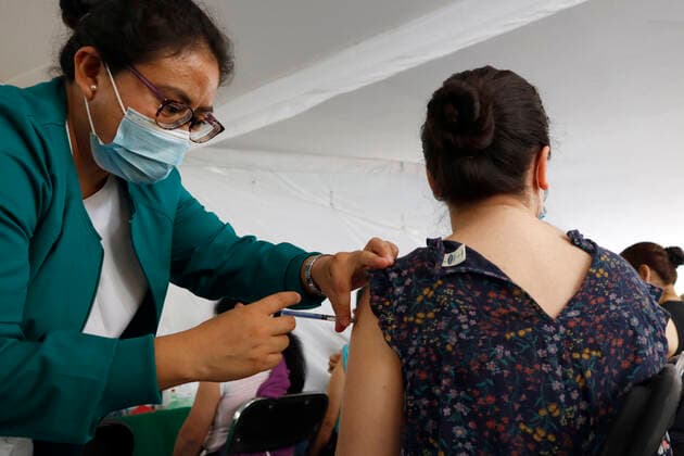 Pfizer Covid-19 Vaccination Campaign In Mexico A person receives a Pfizer BioNTech dose during mass vaccination campaign for people of 40 to 49 years old to immunize against Covid-19 disease at Campo Marte on June 10, 2021 in Mexico City, Mexico. Mexico City Mexico group-pfizerco210609_npaOt  Copyright: xEyepixx