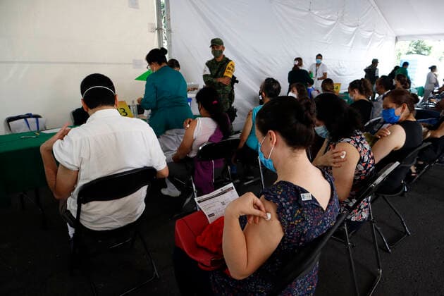 Pfizer Covid-19 Vaccination Campaign In Mexico Persons are seen in waiting zone after receive a Pfizer BioNTech dose during mass vaccination campaign for people of 40 to 49 years old to immunize against Covid-19 disease at Campo Marte on June 10, 2021 in Mexico City, Mexico. Mexico City Mexico group-pfizerco210609_npgvv  Copyright: xEyepixx