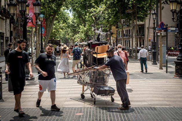 June 11, 2021, Barcelona, Spain: On this Friday morning a scrap metal collector pushes his trolley by La Rambla in Barcelona where the presence of tourists among locals is increasing. Spain aims to boost tourism industry recovering visitors after more than a year of the coronavirus pandemic and has started to issue and accept the QR codes, which allow travelers freedom of movement with no need to show coronavirus tests nor quarantine if they meet the required criteria. Barcelona Spain - ZUMAb137 20210611_zap_b137_008 Copyright: xJordixBoixareux