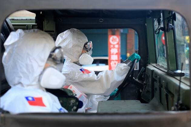 June 12, 2021, New Taipei, New Taipei, Taiwan: Chemical troop soldiers wearing a PPE seen on a military vehicle, as they disinfect public areas in New Taipei, a zone deeply affected by the community transmission of Covid-19. Taiwan has seen an increasing number of domestic cases and deaths related to the coronavirus while facing an inadequate supply of vaccines. New Taipei Taiwan - ZUMAs313 20210612_zip_s313_009 Copyright: xDanielxCengxShou-Yix