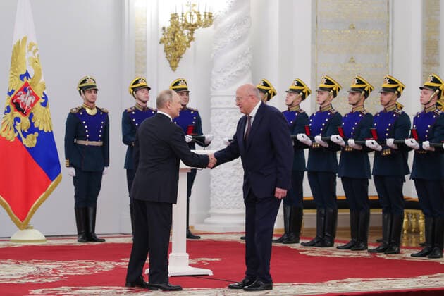 MOSCOW, RUSSIA - JUNE 12, 2021: Russia s President Vladimir Putin and Alexander Gintsburg (L-R front), Head of Gamaleya Research Insitutue of Epidemiology and Microbiology, a winner of the 2020 State Prize in science and technology, shake hands during a ceremony held at the Moscow Kremlin on Russia Day to present state decorations and prizes. Mikhail Klimentyev Russian Presidential Press and Information Office TASS  TS1046CC