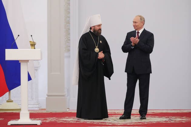 MOSCOW, RUSSIA - JUNE 12, 2021: Russia s President Vladimir Putin and Metropolitan Ilarion of Volokolamsk, Chairman of the Department of External Church Relations of the Moscow Patriarchate, a winner of the 2020 State Prize in literature and arts, pose during a ceremony held at the Moscow Kremlin on Russia Day to present state decorations. Mikhail Klimentyev Russian Presidential Press and Information Office TASS  TS1046D1