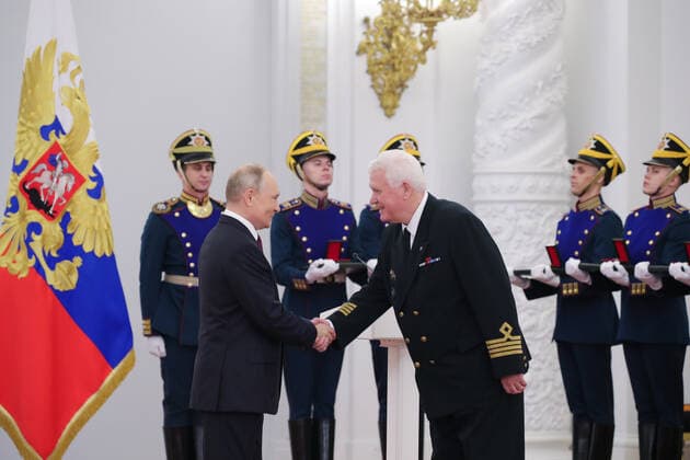 MOSCOW, RUSSIA - JUNE 12, 2021: Russia s President Vladimir Putin and Gennady Antokhin (L-R front), captain instructor of the security and quality department of the Far East Shipping Company s Vladivostok office, awarded a a Hero of Labour medal, shake hands during a ceremony held at the Moscow Kremlin on Russia Day to present state decorations and prizes. Mikhail Klimentyev Russian Presidential Press and Information Office TASS  TS1046DC
