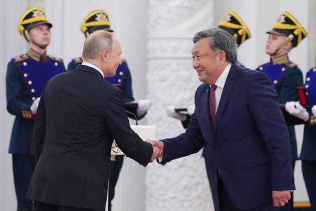 MOSCOW, RUSSIA - JUNE 12, 2021: Russia s President Vladimir Putin and Yevgeny Choinzonov (L-R front), Director of the Tomsk National Research Medical Centre, a winner of the 2020 State Prize in science and technology, shake hands during a ceremony held at the Moscow Kremlin on Russia Day to present state decorations and prizes. Mikhail Klimentyev Russian Presidential Press and Information Office TASS  TS1046E2